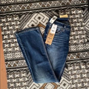 Silver Aiko mid-rise bootcut jeans.